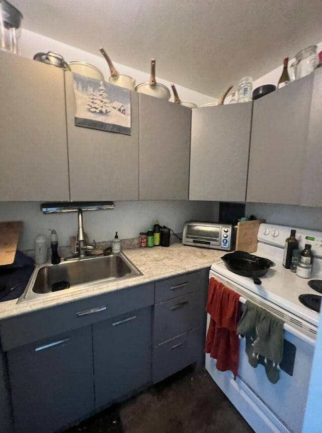 kitchen with white electric range and sink