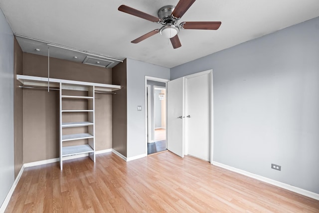 unfurnished bedroom with light hardwood / wood-style floors, a closet, and ceiling fan