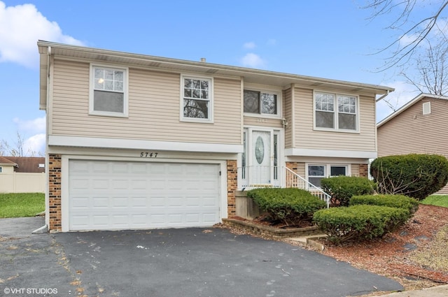 split foyer home featuring a garage