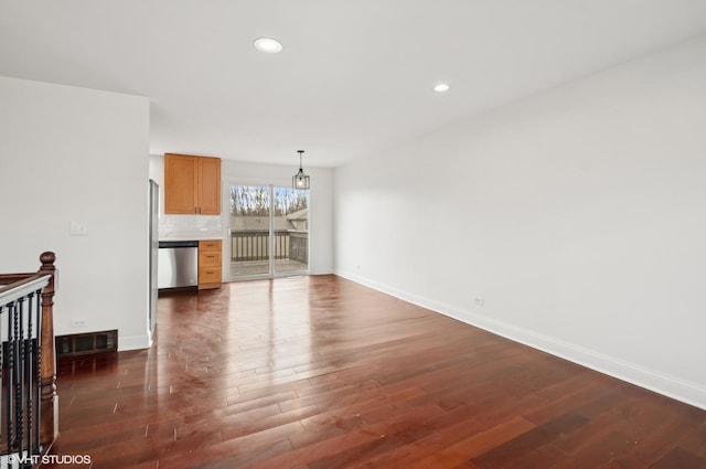 unfurnished living room with dark wood-type flooring