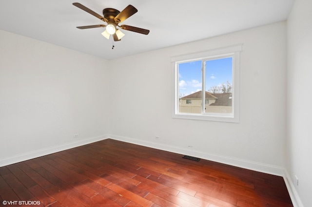 unfurnished room featuring dark hardwood / wood-style flooring and ceiling fan