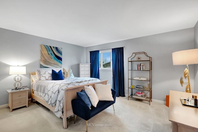 bedroom featuring light colored carpet