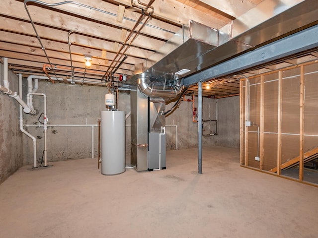 basement with water heater and heating unit