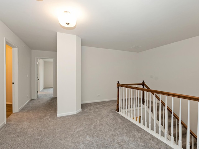 bonus room with light colored carpet