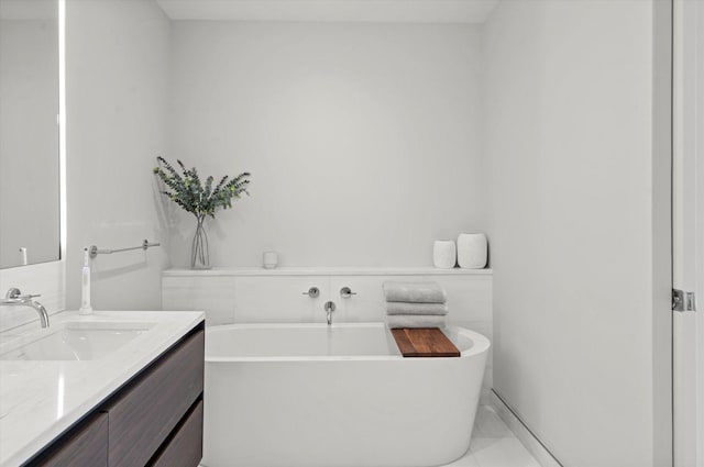 bathroom with vanity and a bathing tub