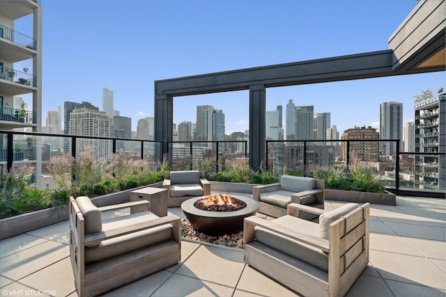 view of patio / terrace featuring a fire pit