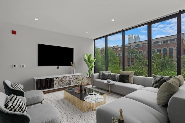 living room featuring hardwood / wood-style floors and a wall of windows