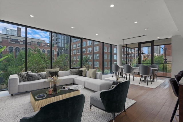 living room featuring hardwood / wood-style floors and a wall of windows