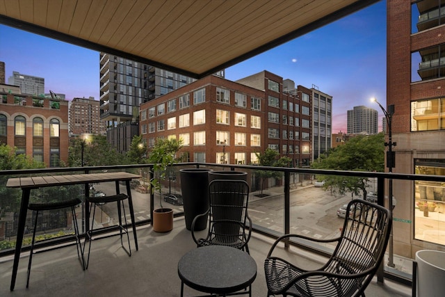 view of balcony at dusk