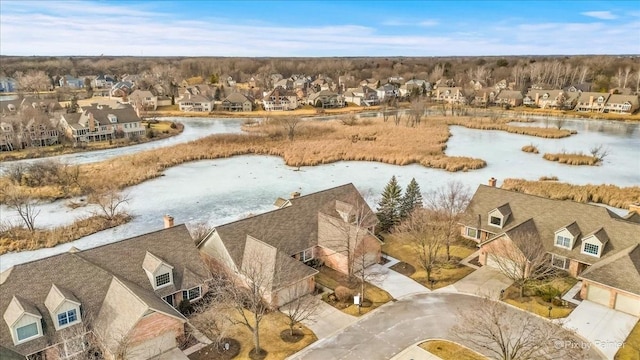 bird's eye view with a water view