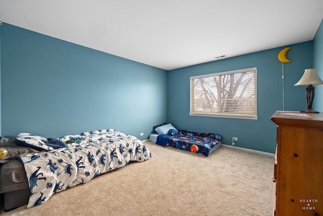 bedroom with carpet flooring, visible vents, and baseboards