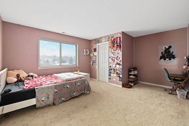 bedroom with carpet and baseboards