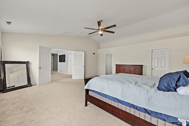 bedroom featuring lofted ceiling, ceiling fan, light colored carpet, visible vents, and baseboards