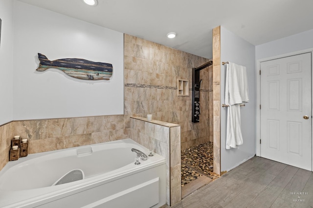 full bath featuring a walk in shower, wood finished floors, a garden tub, and recessed lighting