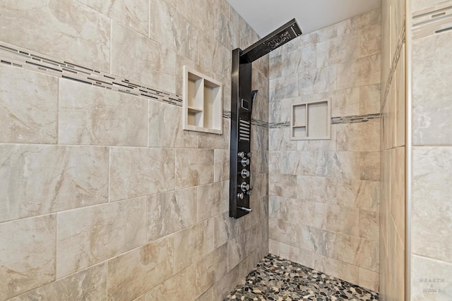 bathroom featuring tiled shower