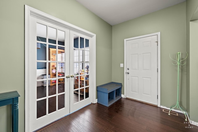 entryway with french doors, visible vents, dark wood finished floors, and baseboards