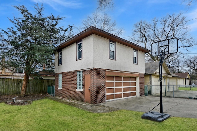 view of home's exterior with a garage and a lawn