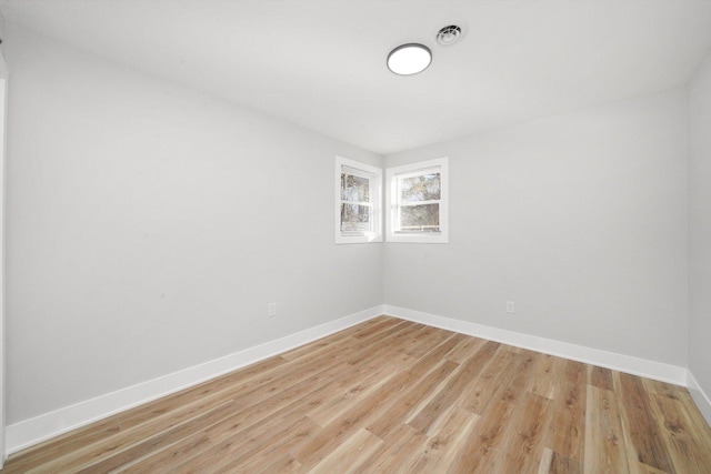 unfurnished room featuring light wood-type flooring