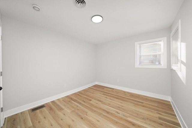 unfurnished room with light hardwood / wood-style flooring