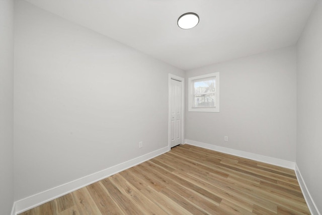 spare room with light wood-type flooring