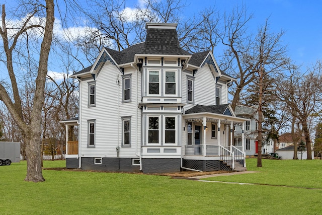 view of front of property with a front yard and cooling unit