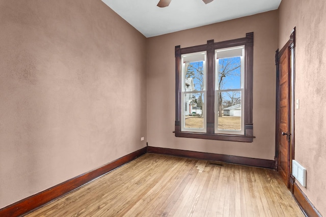 unfurnished room featuring ceiling fan and light wood-type flooring