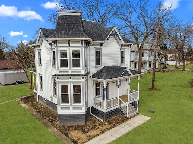 exterior space with a yard and covered porch