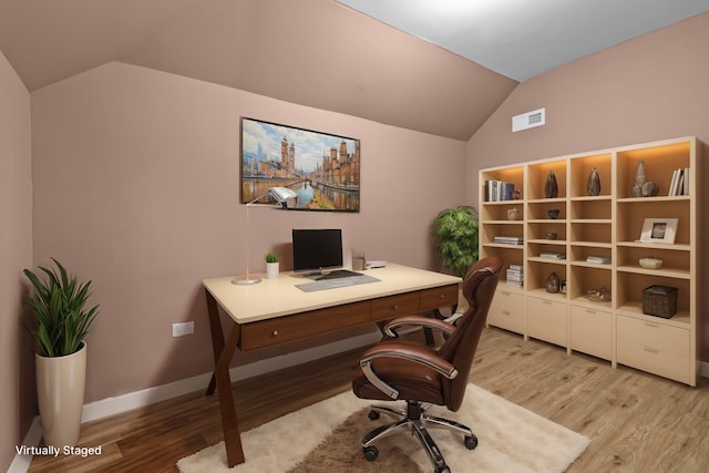 office area with lofted ceiling and light hardwood / wood-style floors