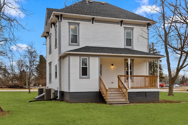 exterior space featuring a front yard, covered porch, and central air condition unit