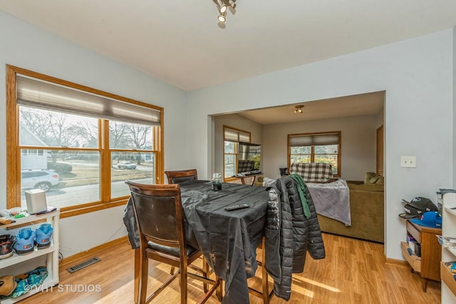 dining space featuring light hardwood / wood-style flooring