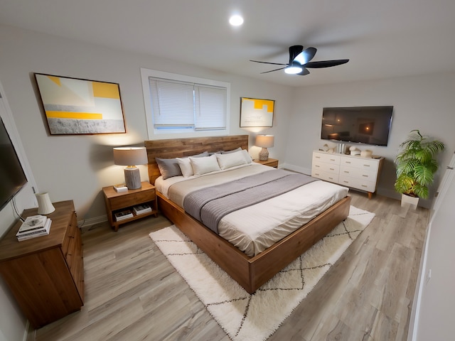 bedroom with ceiling fan and light wood-type flooring