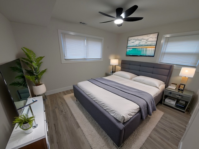 bedroom featuring wood-type flooring and ceiling fan