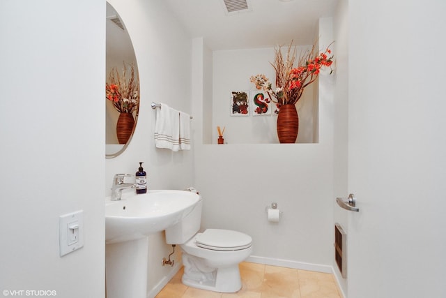 bathroom featuring tile patterned floors and toilet