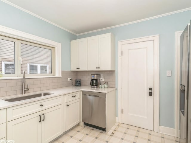 kitchen with sink, stainless steel dishwasher, ornamental molding, white cabinets, and backsplash