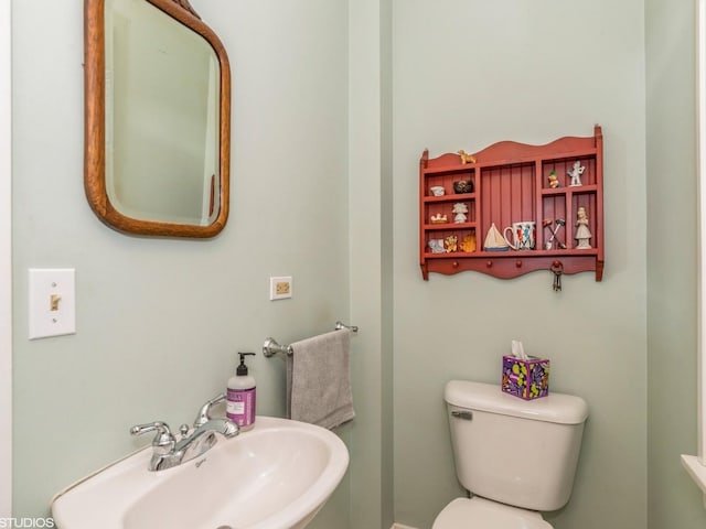 bathroom with sink and toilet