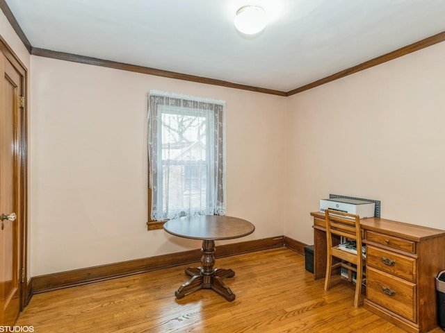 office area with crown molding and light hardwood / wood-style floors