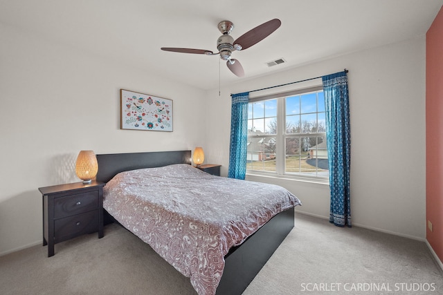 bedroom featuring light carpet and ceiling fan