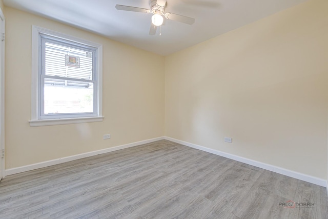 7345 S Washtenaw Ave, Chicago, IL 60629 - unfurnished room with ceiling fan and light hardwood / wood-style floors