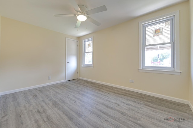 7345 S Washtenaw Ave, Chicago, IL 60629 - spare room with ceiling fan and light hardwood / wood-style flooring