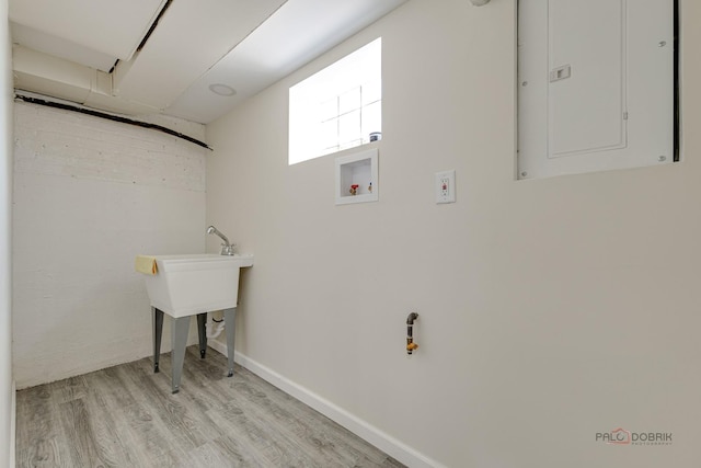 7345 S Washtenaw Ave, Chicago, IL 60629 - laundry room with washer hookup, light hardwood / wood-style floors, and electric panel