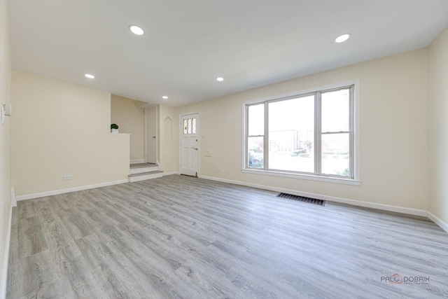 7345 S Washtenaw Ave, Chicago, IL 60629 - unfurnished living room with light wood-type flooring