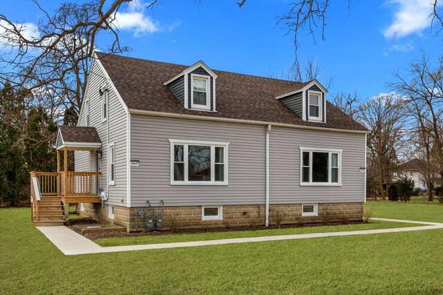 view of side of property with a lawn