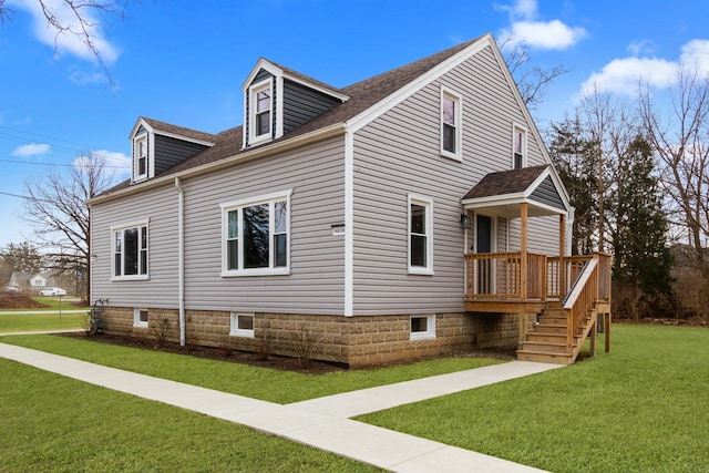 view of side of home featuring a lawn