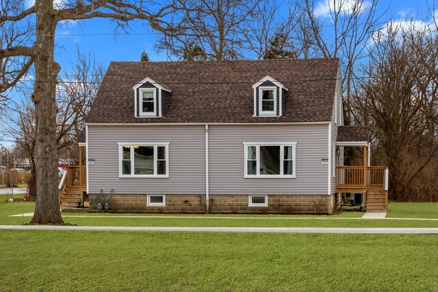 exterior space featuring a garage, an outdoor structure, and a front yard