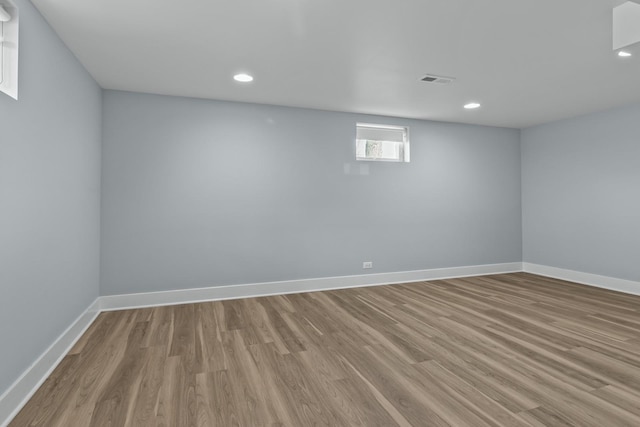 basement featuring light hardwood / wood-style flooring