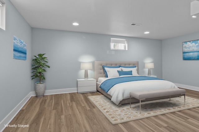 bedroom with light hardwood / wood-style flooring