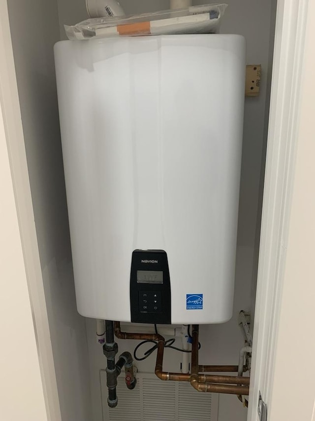 utility room with water heater