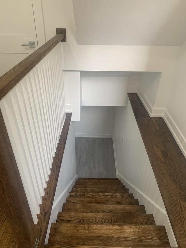 stairs with wood-type flooring