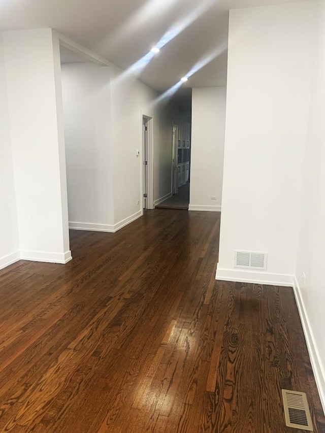 spare room featuring dark hardwood / wood-style flooring