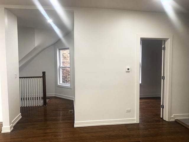 hallway with dark hardwood / wood-style floors